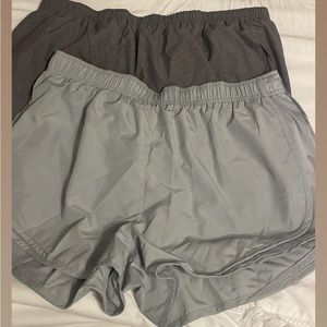 Two pairs of Nike running shorts